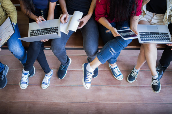 Young people being used computer and tablet